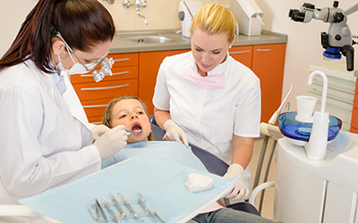 A young girl having work done on her teeth
